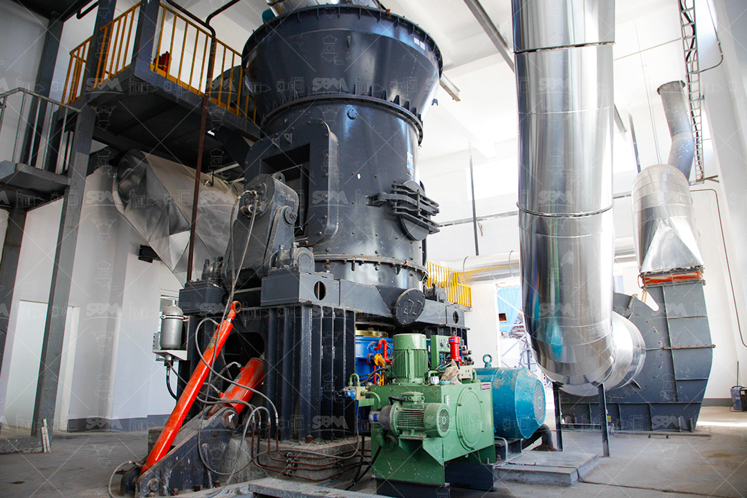 Compact industrial grinding plant outdoor installation showing vertical roller mill and ancillary equipment in a small footprint.