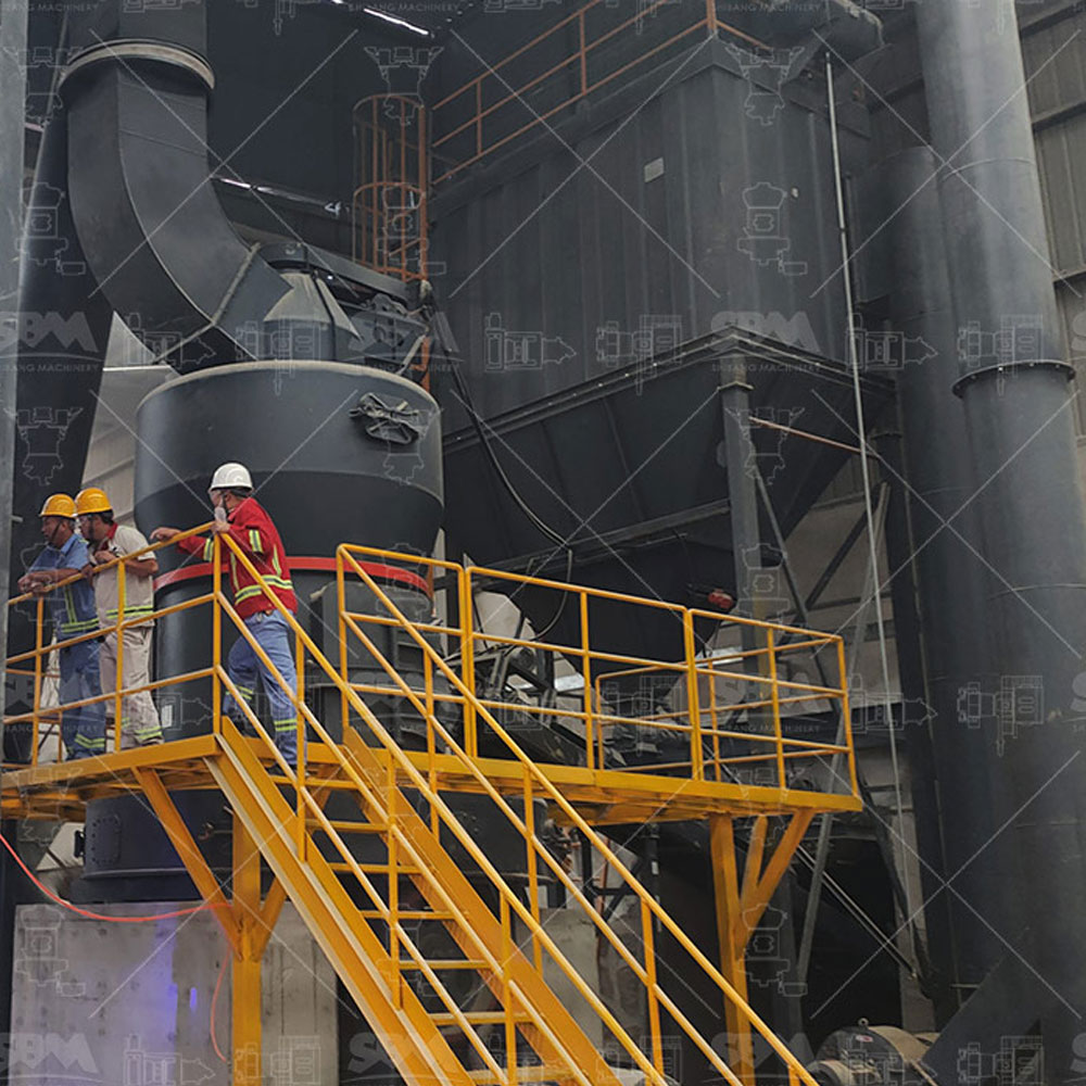 Operator monitoring a PLC control panel displaying real-time data from a grinding and pneumatic conveying production line.