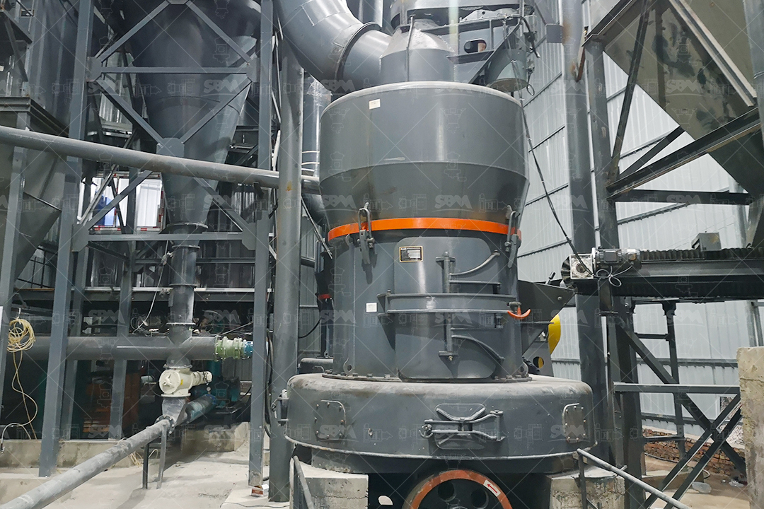 A large industrial screw conveyor transporting fine powder in a modern processing plant, showing clean, enclosed design.