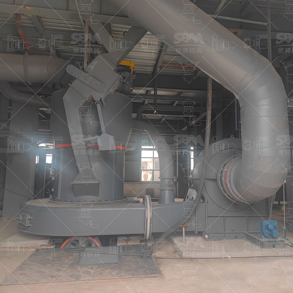 Technician inspecting the combined-type shovel blade and arc air duct of an MTW European Trapezium Mill during shutdown.