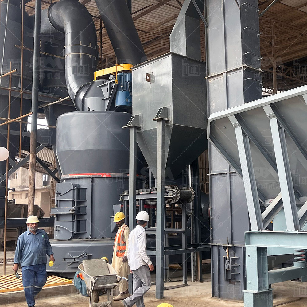 Operator checking grease level in Raymond mill automatic lubrication system
